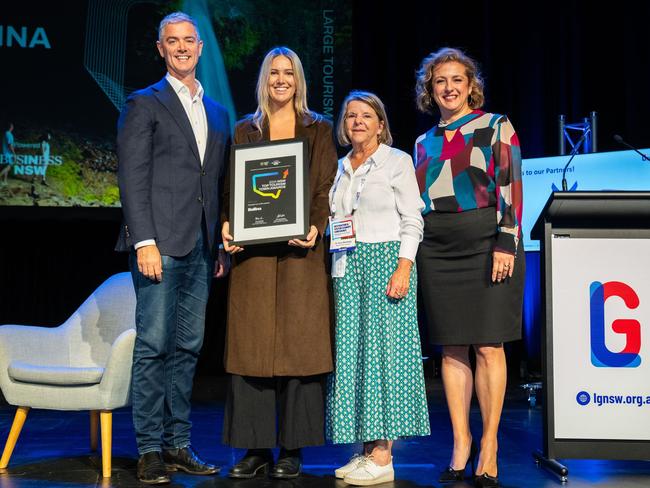 Hon. John Graham (left) presents Alanah Ward, Team Leader of Visitor Services, and Ballina Shire cr Eva Ramsey with the NSW Top Tourism Town Silver Award with Paula Martin, Executive Director NSW Tourism Industry Council (right). Picture: Matt Beaver