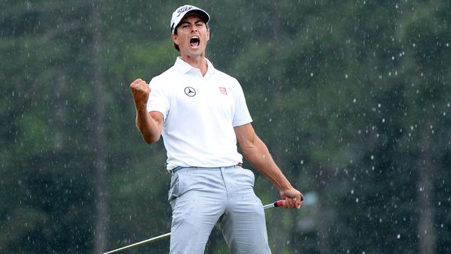 ‘C’mon Aussie!’ Adam Scott birdies the 18th at Augusta during the 2013 Masters. Picture: Getty Images