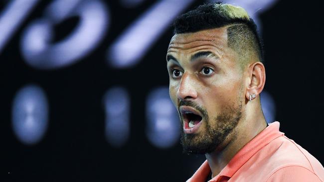 Australia's Nick Kyrgios reacts after a point against Spain's Rafael Nadal during their men's singles match on day eight of the Australian Open tennis tournament in Melbourne on January 27, 2020. (Photo by William WEST / AFP) / IMAGE RESTRICTED TO EDITORIAL USE - STRICTLY NO COMMERCIAL USE