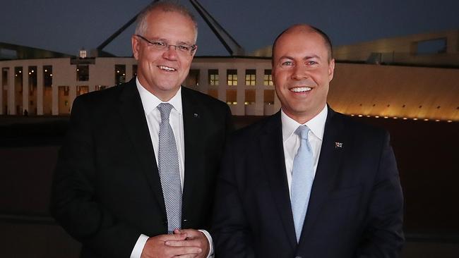 PM Scott Morrison and Treasurer Josh Frydenberg in a media scrum before appear on morning TV out the front of Parliament House in Canberra. Picture Kym Smith