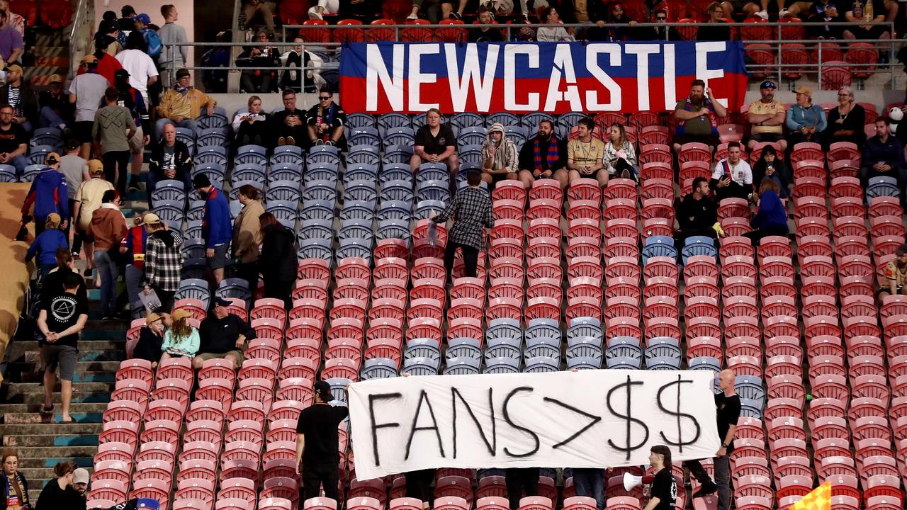 A group of Jets fans leave the stadium in protest during the round eight A-League Men's match between Newcastle Jets and Brisbane Roar at McDonald Jones Stadium. Picture: Brendon Thorne