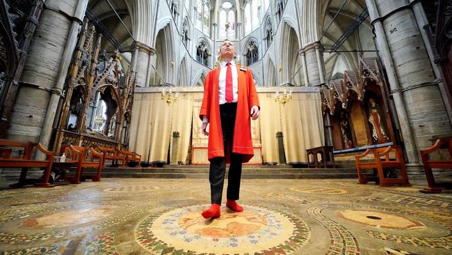 Howard Berry, a marshal at Westminster Abbey, walks across the Cosmati Pavement where the King will be crowned. Picture: PA