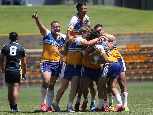 Patrician Brothers Blacktown players celebrate as the final whistle is sounded. Picture: Richard Dobson