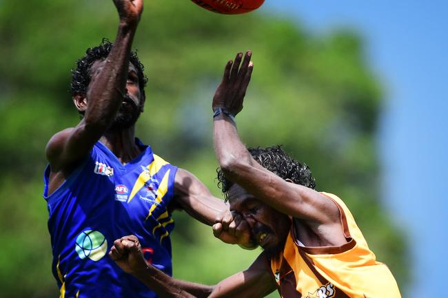 Ranku Eagles Kevin Portaminni clocks Tapalinga Superstars Gene Puruntatameri during this year's 49th Annual Tiwi Grand Final at Wurrumyanga Oval on Bathurst Island Picture: Justin Kennedy