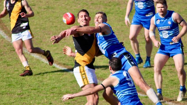 SHOC's Alex Cailotto battles Broadview's Jesse White in this year's second semi-final. Picture: SHOC Football Club