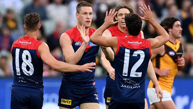 Tom McDonald (second from left) celebrates a Melbourne goal against Hawthorn on Saturday. Picture: Getty Images