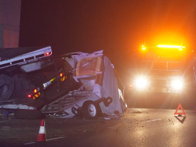 A truck driver was hurt and his vehicle and the two caravans he was carting were damaged in a dramatic crash on the M1 Pacific Highway at Woombah at about 9.30pm on March 13, 2023. Picture: Jackson Whitney