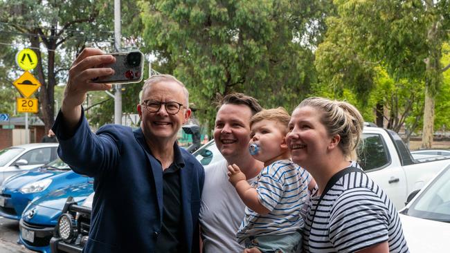 The PM stopped to take selfies with families as he made his way through Macleod towards a children’s playground. Picture: NCA NewsWire / Valeriu Campan