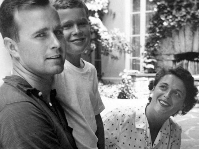 George HW Bush, left, and Barbara Bush pose with their son, George W. Bush, in 1955. Picture: George Bush Presidential Library/AP