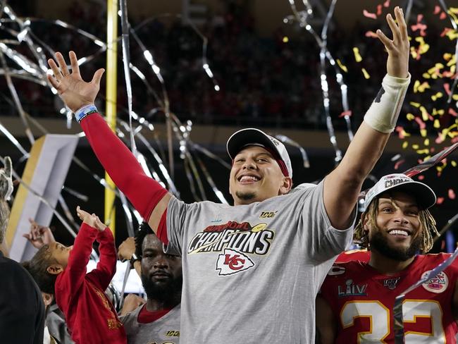 FILE - In this Feb. 2, 2020, file photo, Kansas City Chiefs' Patrick Mahomes, left, and Tyrann Mathieu celebrate after defeating the San Francisco 49ers in the NFL Super Bowl 54 football game in Miami Gardens, Fla. After leading the Chiefs to their first Super Bowl championship in five decades, Mahomes is finally eligible to sign a contract extension this off-season. Both sides are eager to come to terms on what could be a record-setting deal. (AP Photo/David J. Phillip, File)