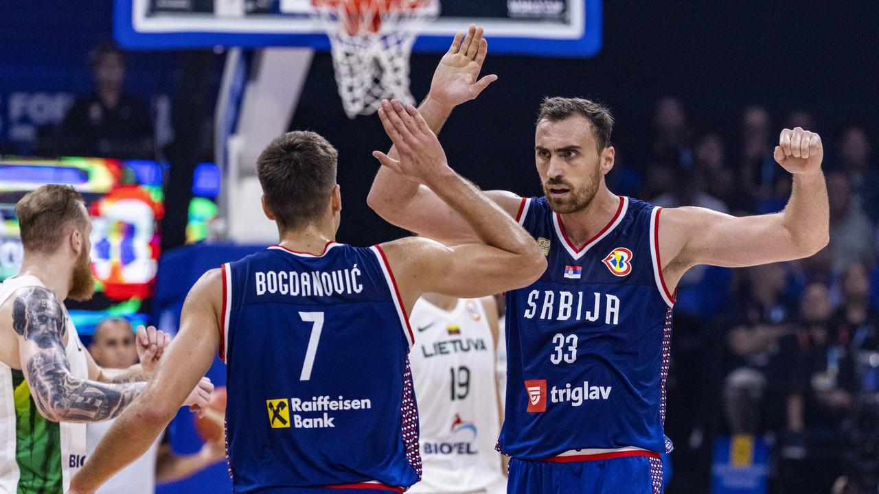 MANILA, PHILIPPINES – SEPTEMBER 05: Nikola Milutinov #33 and Bogdan Bogdanovic #7 of Serbia celebrate after winning the FIBA Basketball World Cup quarterfinal game between Lithuania and Serbia at Mall of Asia Arena on September 05, 2023 in Manila, Philippines. (Photo by Ezra Acayan/Getty Images)