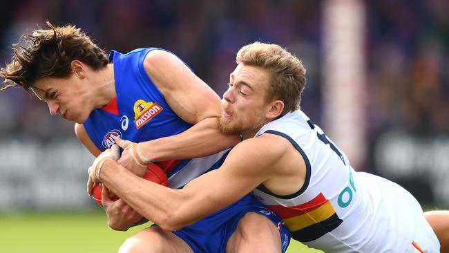 Patrick Lipinski of the Bulldogs is tackled by Hugh Greenwood of the Crows during the round 23 match in Ballarat. Picture: Getty Images