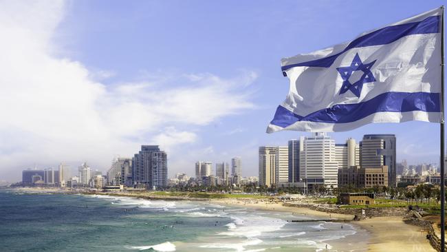 The Israeli flag flies over Tel Aviv.