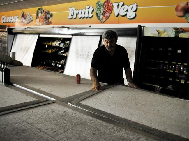 Manuel Kotis from Fannie Bay IGA tries his best to save food in his freezers with big peices of foam - Power has been lost in Darwin, all the way down to Katherine in what Power and Water are calling a short fuse.