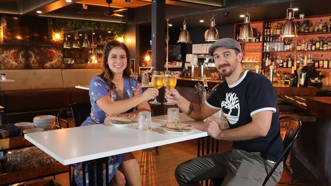 Paradise Point cafe The Local are doing couple's bookings this weekend to manage the 10 person limit. Runaway Bay couple Vanessa Cardona and Nicola Paro can’t wait for the weekend. Picture Glenn Hampson