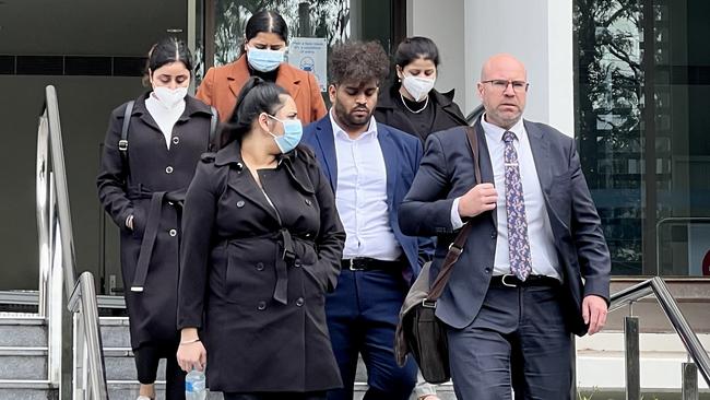 Supporters of Jaskaren Singh leaving Wollongong Courthouse alongside lawyer Patrick Schmidt on Tuesday. Picture: Dylan Arvela