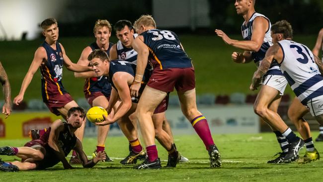 Cairns City Lions Number 7 Thomas Lindenmayer looks for an opening during the AFl Cairns Mens Preliminary Finals Saturday Night. Picture: Emily Barker.