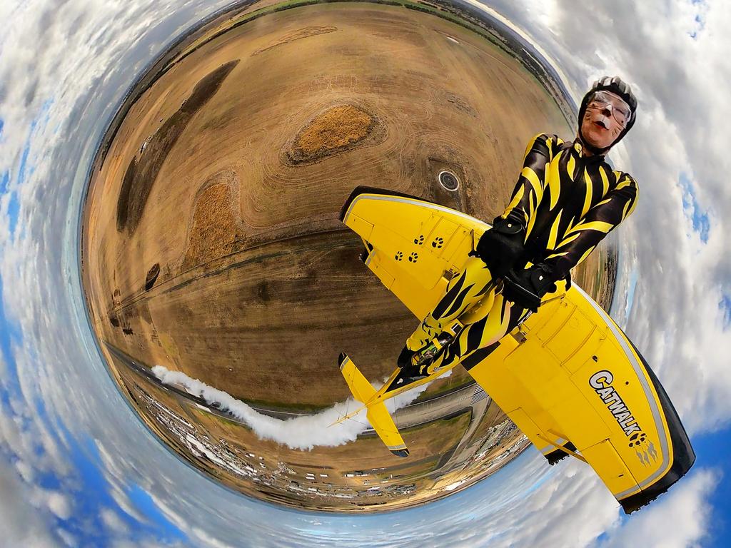 Scandinavian Airshow Skycats wingwalker Hella Stening performs high flying stunts over Avalon. Picture: David Caird