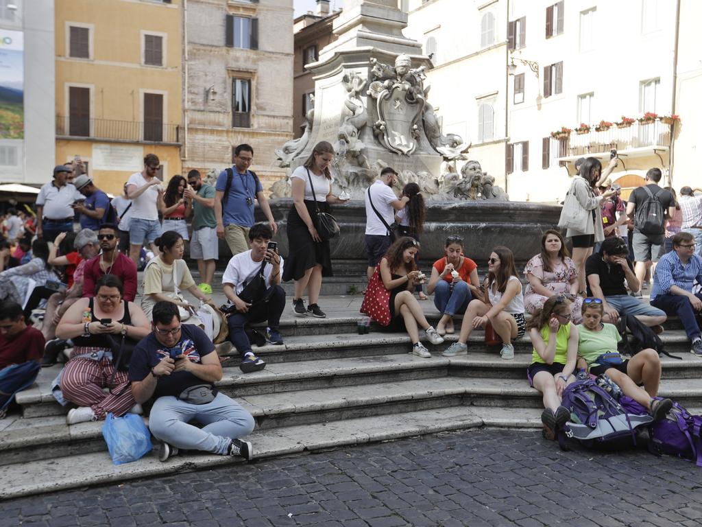 Escaping the heat and taking a dip in the city’s many fountains is a massive no-no. Picture: AP/Gregorio Borgia