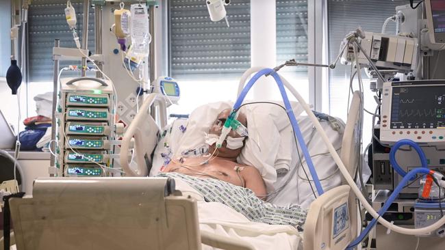 A patient infected with COVID-19 lies in an intensive care unit in Paris, France last week as the country adopted new measures to fight the virus spread. Bertrand Guay / AFP