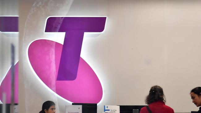 Customers and assistants are seen in a Telstra store in Sydney, Monday, July 9, 2018. Investors hoping to maintain their dividend payments from Telstra might be in for a shock, with Plato Investment Management managing director Don Hanson warning the rivers of gold are over for the telecommunications company. (AAP Image/Mick Tsikas) NO ARCHIVING