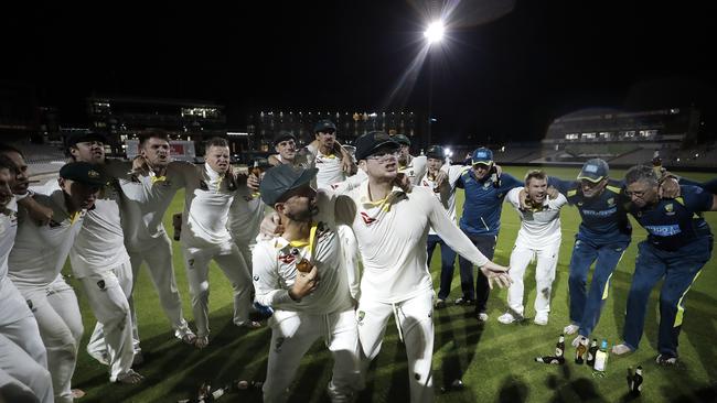 Lyon leads the Aussies in an Ashes victory song in 2019.