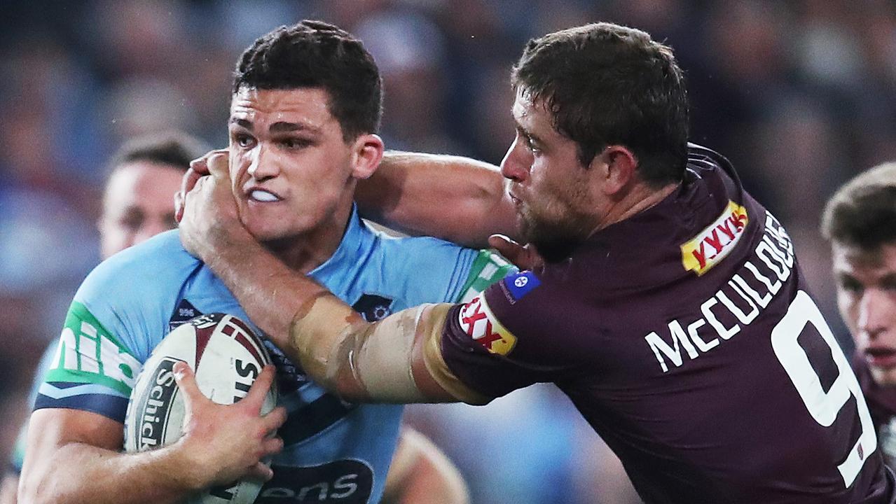 NSW’s Nathan Cleary is tackled by Queensland hooker Andrew McCullough during Origin II in Sydney.