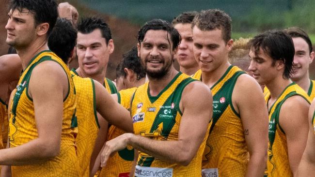 Saint Anthony Long, centre, with teammates. Picture: Aaron Black AFLNT/Media