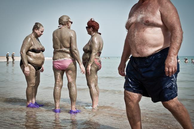 2014 National Geographic Photography Contest ... Honorable Mention People Photo: “Dead Sea Mudbathing” Seekers of eternal youth coat themselves in mineral-rich mud, at the Dead Sea in Israel. Location: Dead Sea, Israel. Picture: Nick Riley /National Geographic 2014 Photo Contest