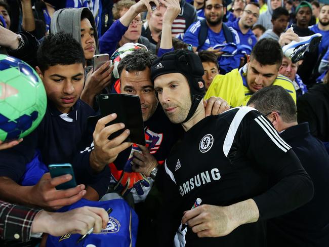 Chelsea FC's Petr Cech signs a few autographs after the Chelsea FC training session at ANZ Stadium, Sydney. Pic Brett Costello