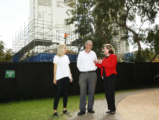 Karen Kennedy from HammondCare, St John's Rector Ed Vaughan and HammondCare's Louise Burton in front of the development on Darlinghurst Rd. Picture: John Appleyard