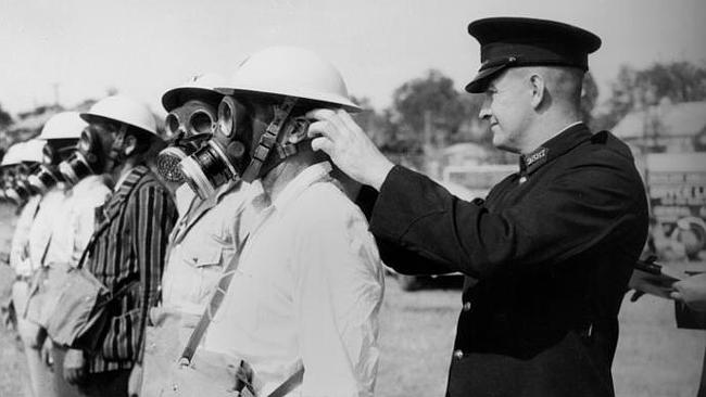 Men get their gas masks checked at Auchenflower in 1942. Picture: State Library