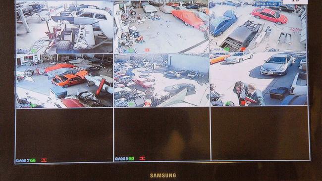 A TV showing security vision from around the warehouse. Picture released by Supreme Court.