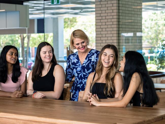 St Aidan's Anglican Girls' School principal Toni Riordan celebrates with high-achieving students, from left, Sanuli Ranatunga, Lucy Bristow, Isla Williams and Shreya Jayaram.