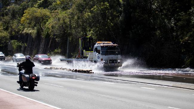 A photo of water gushing over Epping Rd.