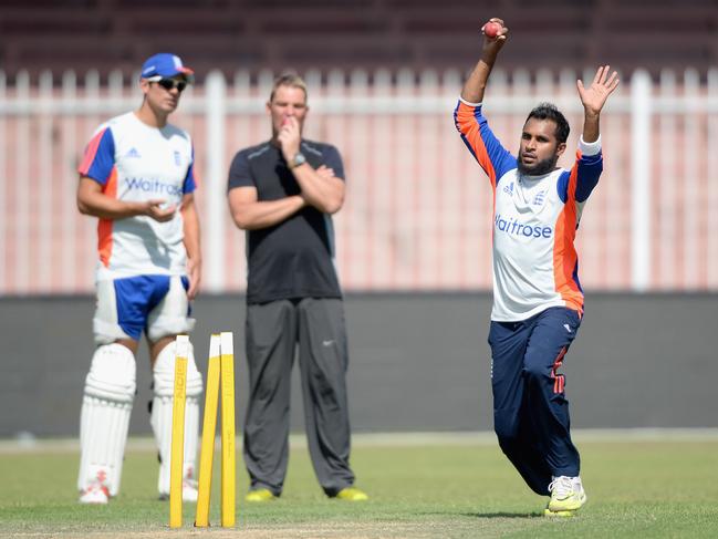 England leg-spinner Adil Rashid bowls while watched by Alastair Cook and Shane Warne during a nets session at Sharjah Cricket Stadium in October 2015. Picture: Gareth Copley/Getty Images