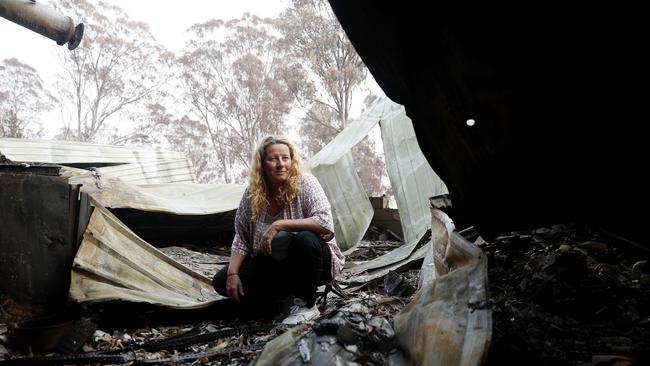 Venessa Downing in the ruins of her home. Picture: Nikki Short