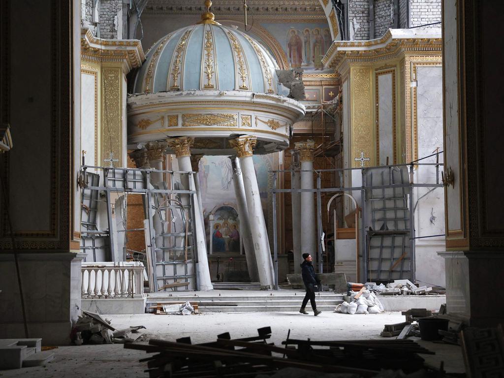 A worker repairs the Cathedral of the Transfiguration damaged as a result of Russian missile strike in Odessa, Ukraine. Picture: Anatolii Stepanov/AFP