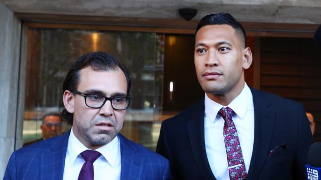 Israel Folau and George Haros outside the Fair Work Commission last year. Picture: John Feder