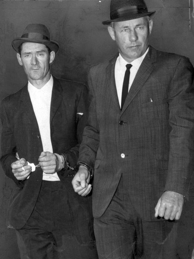 Criminal Ronald Ryan arrested after his escape from Pentridge prison. He murdered a warden during the escape and was the last man executed at Pentridge in 1967.