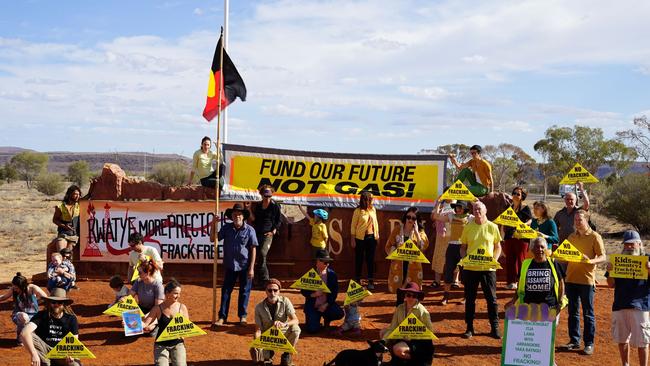 Alice Springs community members staged a highway demonstration as part of the national School Strike 4 Climate on Friday. Picture: Tahl Warchivker