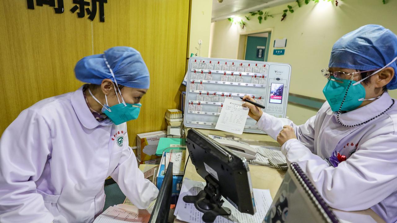 Medical staff members wearing face masks at a hospital in Wuhan in China's central Hubei province. Picture: AFP