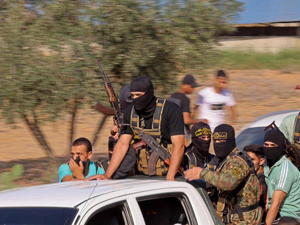 Palestinian militants move towards the border fence with Israel from Khan Yunis in the southern Gaza Strip. Picture: AFP