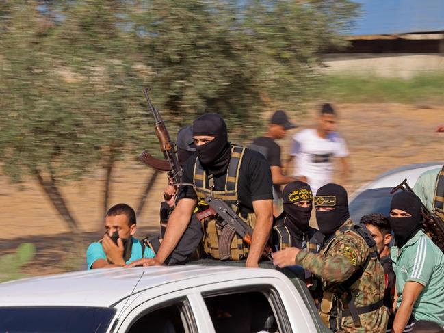 Palestinian militants move towards the border fence with Israel from Khan Yunis in the southern Gaza Strip. Picture: AFP