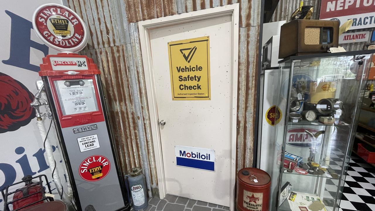 A vintage petrol bowser, signage, and other pieces from Roadside Relics on Brisbane Road, Gympie.