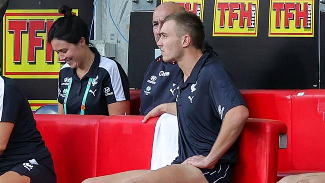 An injured Patrick Cripps watches from the bench. Picture: Russell Freeman/AFL Photos via Getty Images