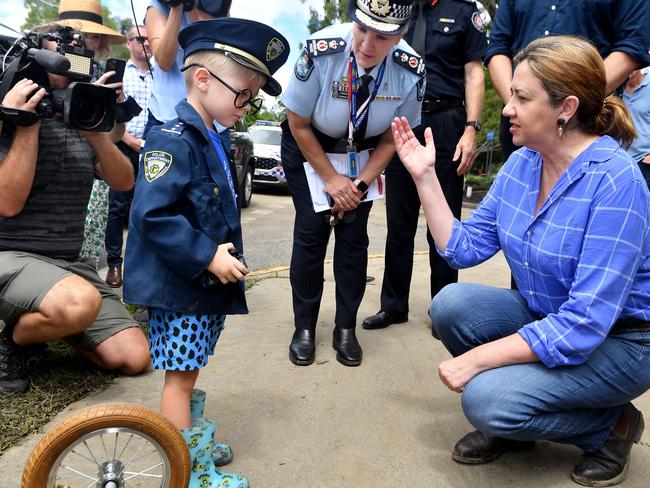 Commissioner of the Queensland Police Service Katarina Carroll and Premier of Queensland Annastacia Palaszczuk talk to four-year-old Beckham Waghorn in Jindalee. Picture: NCA NewsWire / John Gass