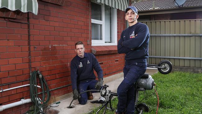 Plumber Will Nehme with first-year apprentice Charlie Beech. Picture: Sarah Reed