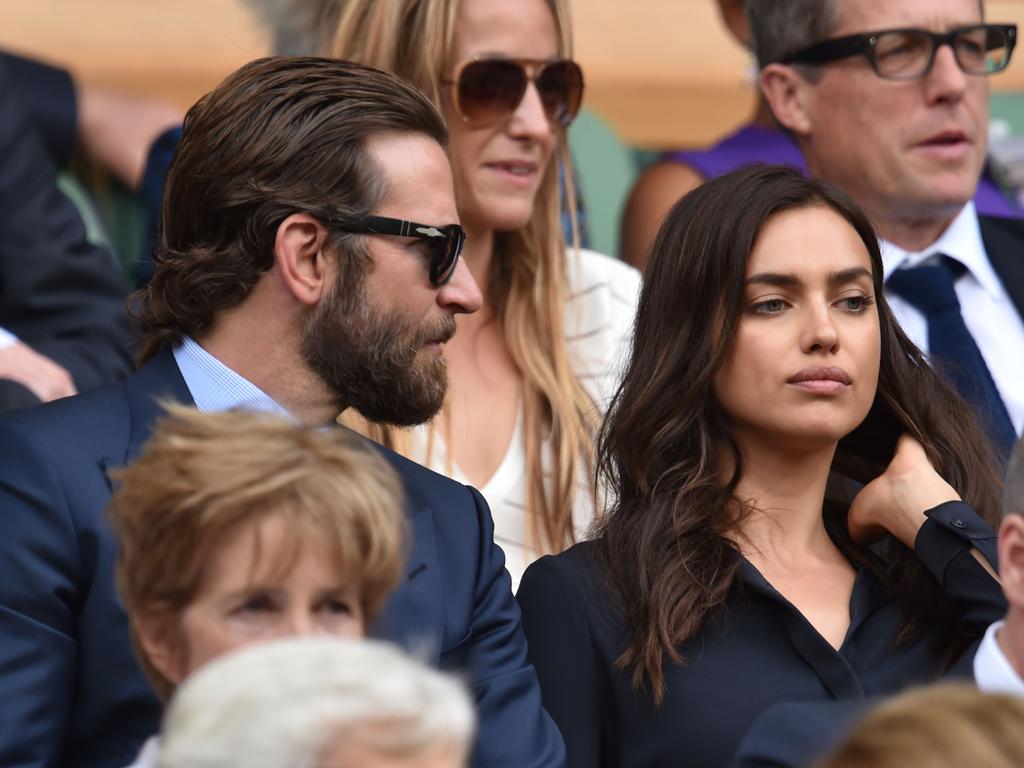 US actor Bradley Cooper and Russian model Irina Shayk sit in the royal box on centre court before the start of the men's singles final match on the last day of the 2016 Wimbledon Championships. Picture: AFP