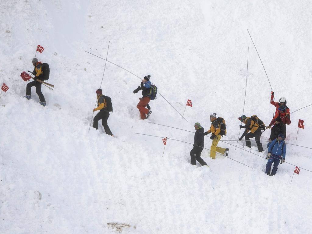 Rescue forces search for missing people after an avalanche swept down a ski piste in the central town of Andermatt, Switzerland. Picture: AP